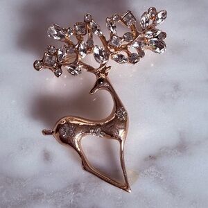 Elegant Gold Reindeer Brooch